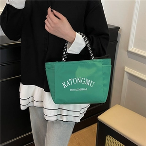 Green high-capacity nylon tote bag with sporty woven handles for casual daily use