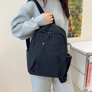 Black water-resistant nylon backpack for minimalist daily commute and travel