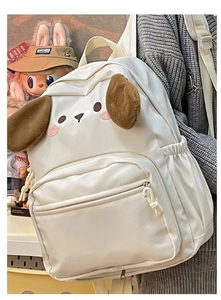 Detailed side view of a white canvas backpack featuring plush ears and cartoon embroidery
