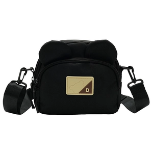 Close-up of black canvas crossbody bag with cute bear ears and double zippers