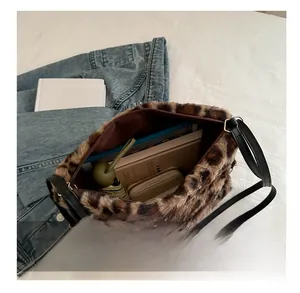 Detailed interior view of a fluffy leopard print shoulder bag showing large capacity
