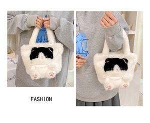 Detail of white plush cat tote bag with 3D ears and cute pink paw embroidery