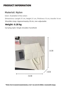 Detailed view of white quilted nylon tote bag with plush down-like texture and soft handle