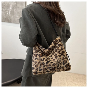 Detail view of the soft leopard print faux fur tote bag showing the plush fluffy texture