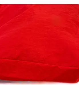 Close-up of red nylon fabric with pleated texture and neat stitching details