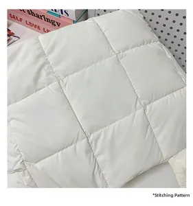 Detailed close-up showing the professional quilted stitching on the white soft cloud tote bag
