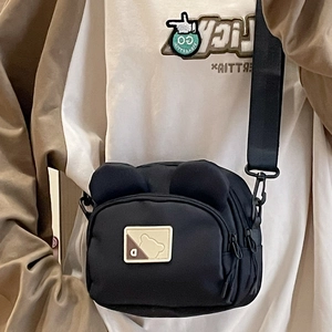 Cute black bear-ear crossbody canvas bag for women featuring a minimalist nylon design