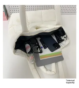 Top view of white quilted puffer tote bag interior showing large storage capacity