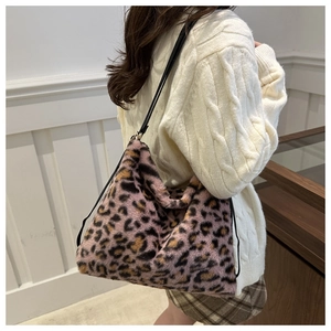 Detailed look at the pink leopard print faux fur tote bag with slim black straps