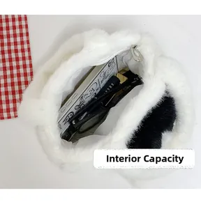 Top view of plush cat bucket bag interior showing capacity for phone and cosmetics