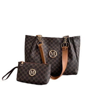 Deep brown tote bag set with M-pattern print and chain strap on white background