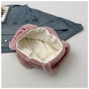 Detail view of pink plush tote bag with magnetic snap closure and soft fabric lining