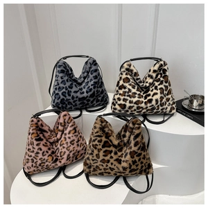 Detail view of four fluffy faux fur leopard print backpacks in various colors with black straps