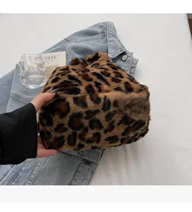 Close-up of fluffy leopard print plush handbag showing soft faux fur texture detail