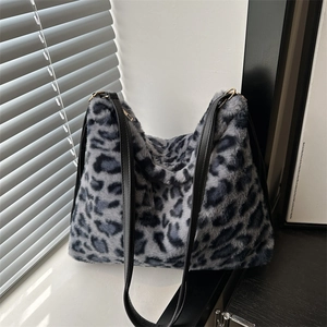 Plush leopard print tote bag in grey-blue faux fur with black leather shoulder straps