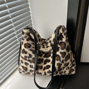 Furry leopard print faux fur tote bag with black straps and golden hardware for winter
