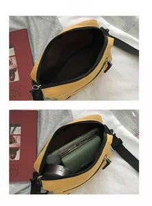 Internal structure of the yellow canvas crossbody bag showing spacious zipper pocket