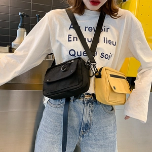 Minimalist canvas crossbody bag for women in black and yellow colors with adjustable strap