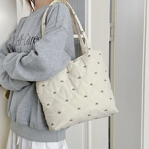 Quilted tote bag with brown butterfly embroidery in creamy white for winter styling