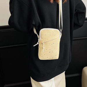 Chic yellow canvas crossbody phone bag with silver star patterns and adjustable strap