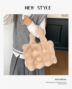Detail of soft cream plush tote bag with fluffy texture and cloud-like pleated design