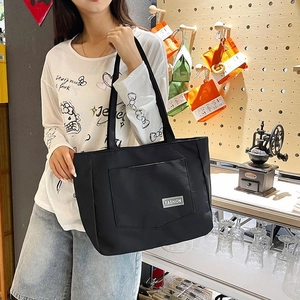 Minimalist large capacity black nylon tote bag with fashion tag for daily commuting