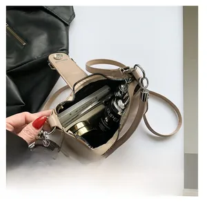 Top view detail of cream beige leather handbag interior showing spacious storage space