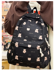 Detail of black backpack with pink cute bear patterns and white cotton rope pullers