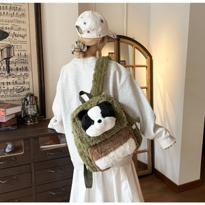 Detail view of green and brown plush panda backpack worn by a girl in cozy indoor setting