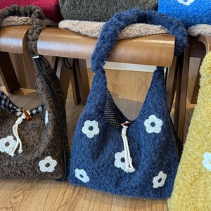 Winter plush floral tote bags in dark blue and yellow with drawstring horn buckle