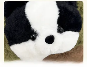 Detail of plush cartoon backpack showing high-quality black and white faux fur and 3D eyes