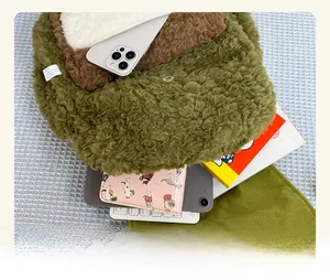 Large capacity plush lamb fleece backpack showing storage space for laptop and phone
