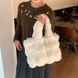 Faux fur tote bag in creamy white plush material for winter daily commuting style