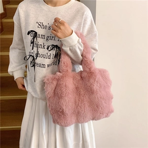 Pink plush faux fur tote bag for women featuring a soft texture and spacious top-handle design