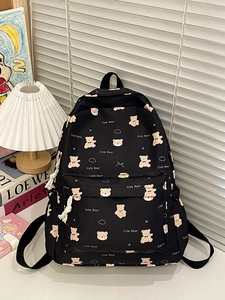 Black nylon backpack with cute bear print and large front pocket for school and travel