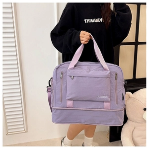 Macro detail of lavender fitness bag featuring multi-pocket design and durable fabric