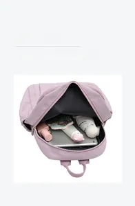 Internal view of purple nylon backpack showing large capacity for tablet and essentials