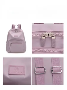 Detail view of purple nylon backpack with double metal zippers and high-density fabric