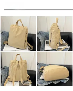 Detail view of beige nylon backpack showing front, side, and anti-theft back pocket