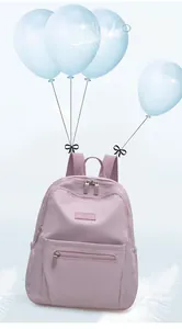 Detailed view of light purple nylon backpack weighing only 350g with floating feathers
