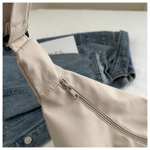 Detail of beige canvas bag with metal zipper and high-quality fabric texture