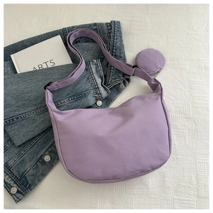 Detail of light purple crescent nylon shoulder bag with a matching mini round coin purse