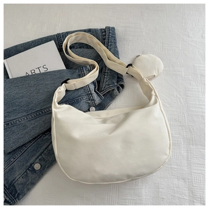 Detail of off-white nylon hobo bag with adjustable strap and matching mini coin purse
