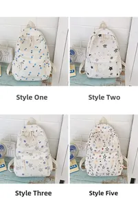 Detail view of four canvas backpacks featuring minimalist star and tulip prints