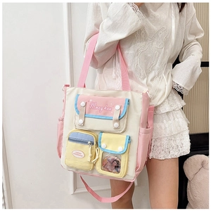 Detail of canvas tote bag with multi-color pockets and a transparent window for cards
