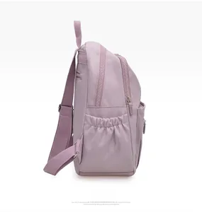 Side view of lavender nylon backpack featuring multiple zippers and elastic side pockets