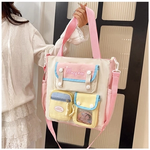 Detail view of large capacity canvas crossbody bag with multi-color pockets and durable straps