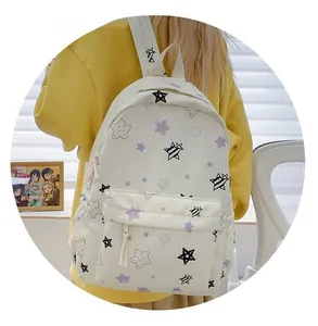 Rear view of a cream star pattern backpack with purple stars and side water bottle pocket