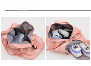 Detail view of the pink gym bag showing dry wet separation layer and a separate shoe compartment