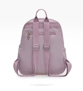 Detail view of the backpack's padded shoulder straps and secure rear anti-theft zipper pocket